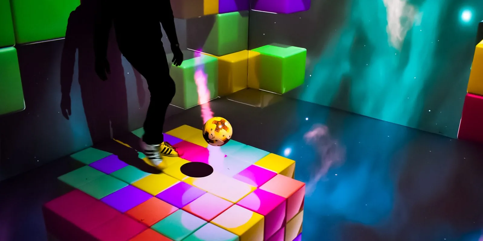 Qube Smash: An original mixed-reality football game: tracking, realtime games engines and an immersive space.
